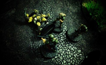 Evans tends to the Predator as Jane and Brauer look on