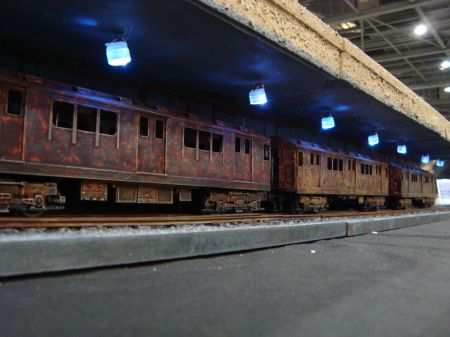 An abandoned subway train sits under the field
