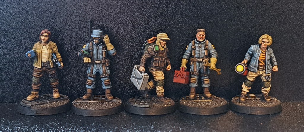 Five science fiction miniatures in a close up photo. The miniatures are from David Sheff Models and The Makers Cult.